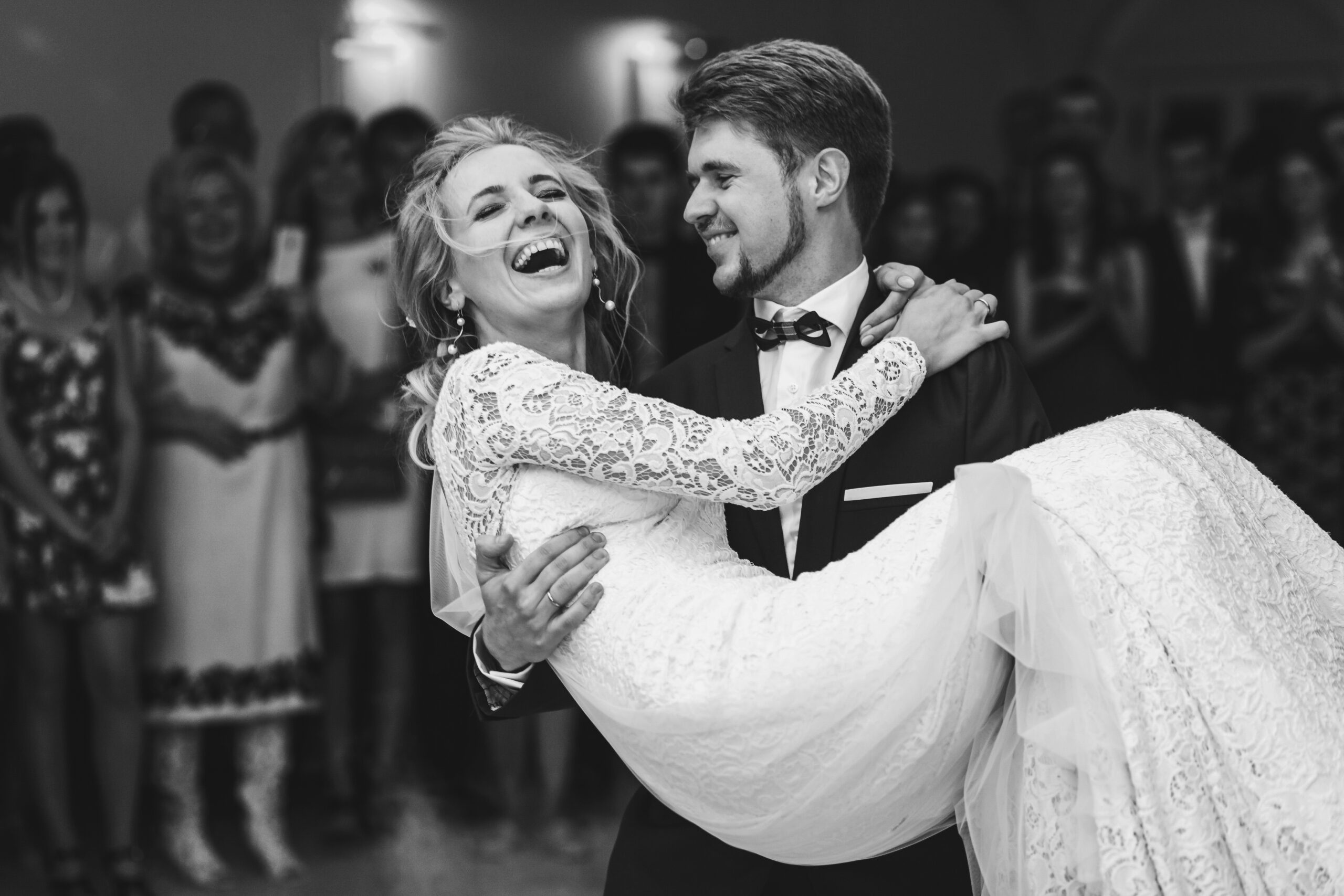 Groom,Admires,Happy,Bride,Laughing,In,His,Arms